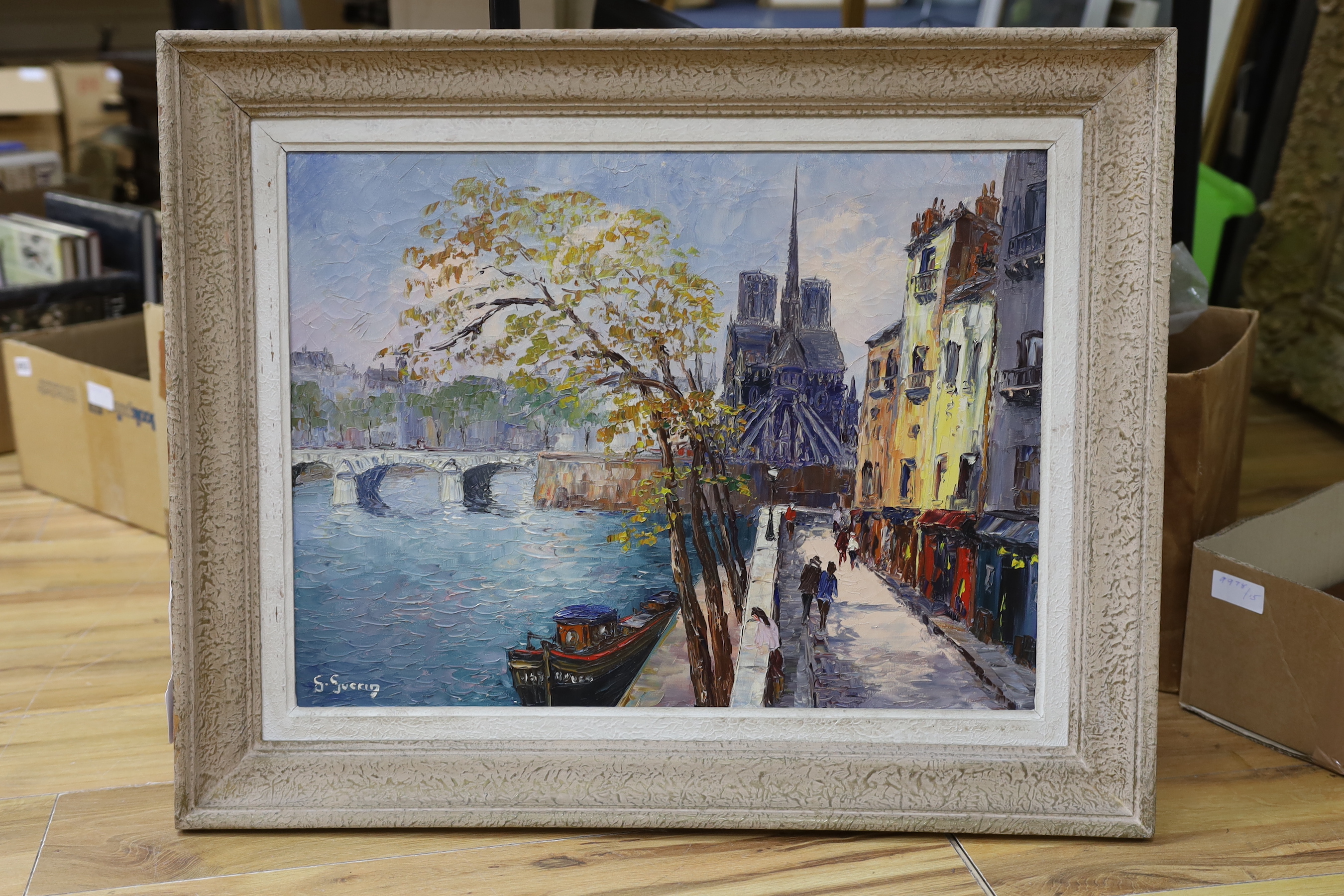 Georges Guerin (French, b.1910), oil on canvas, View along the Seine towards Notre Dame, signed, 45 x 59cm